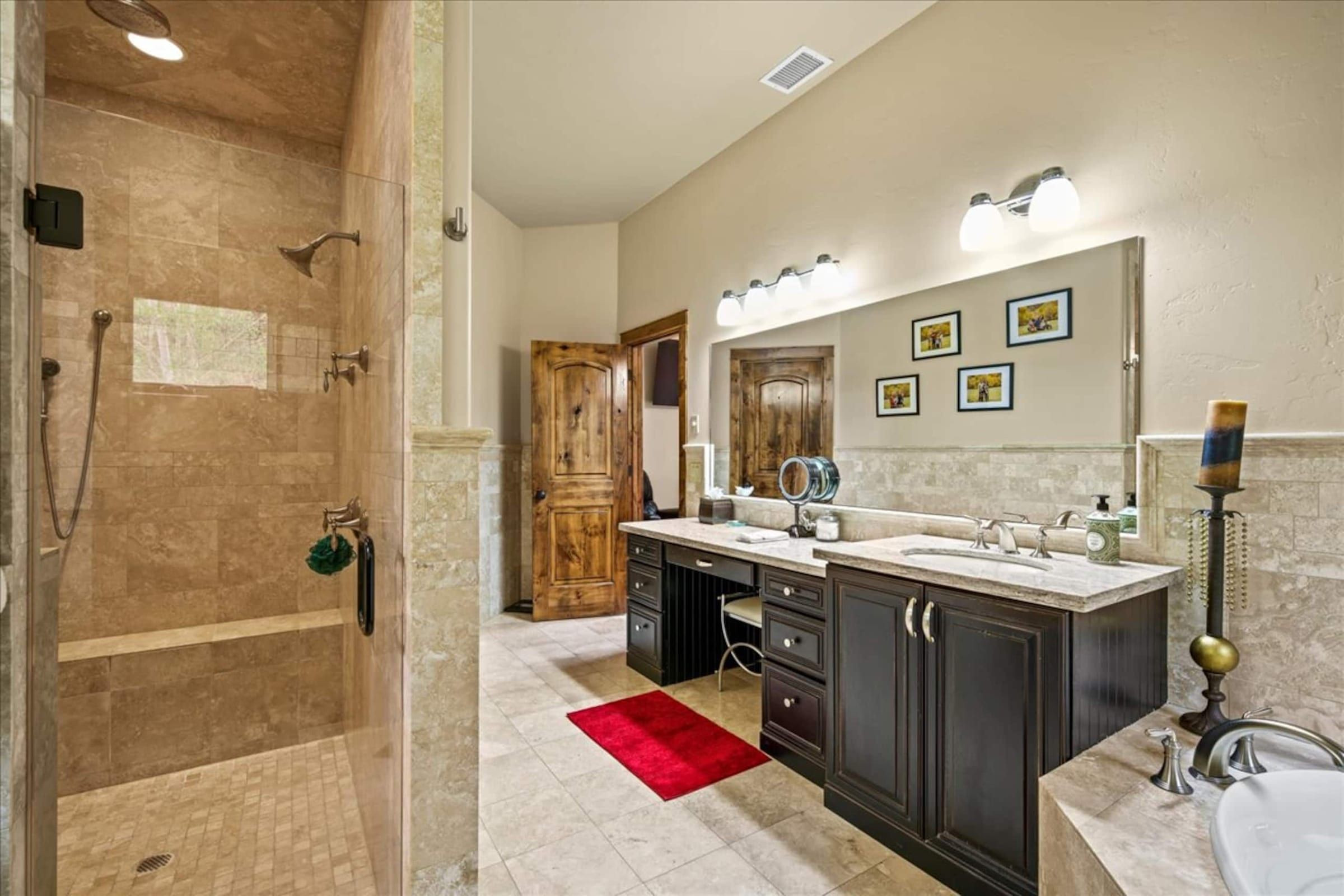 A large walk-in shower and vanity
