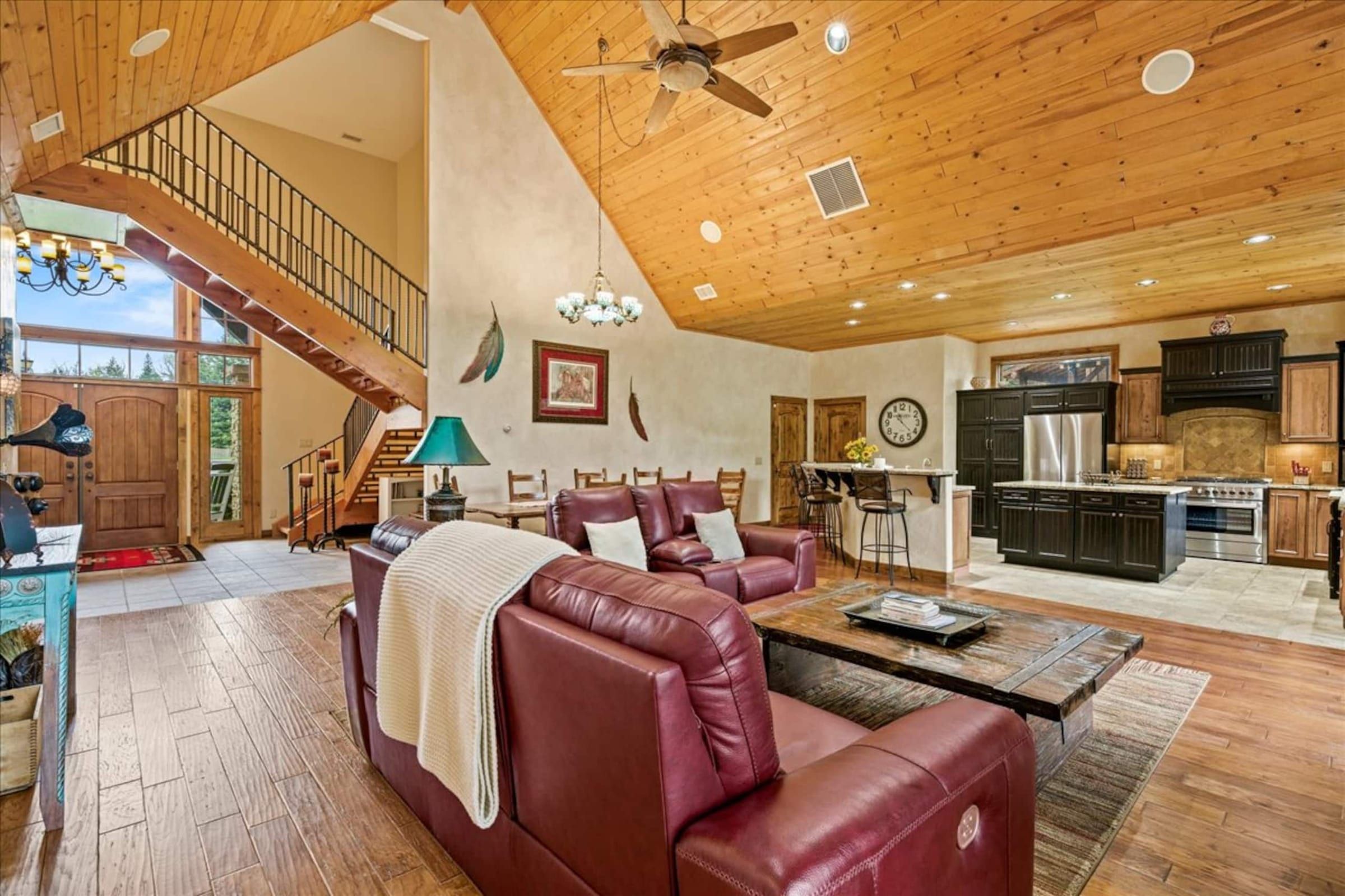 The great room looking toward the kitchen and the loft stairs