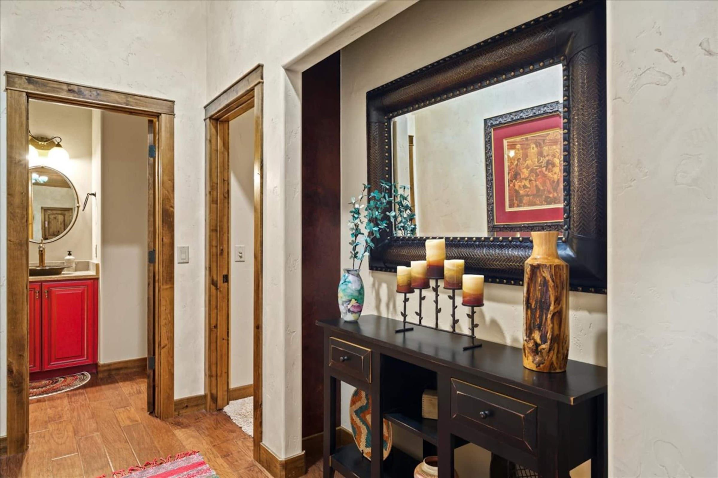 A hallway with a large mirror