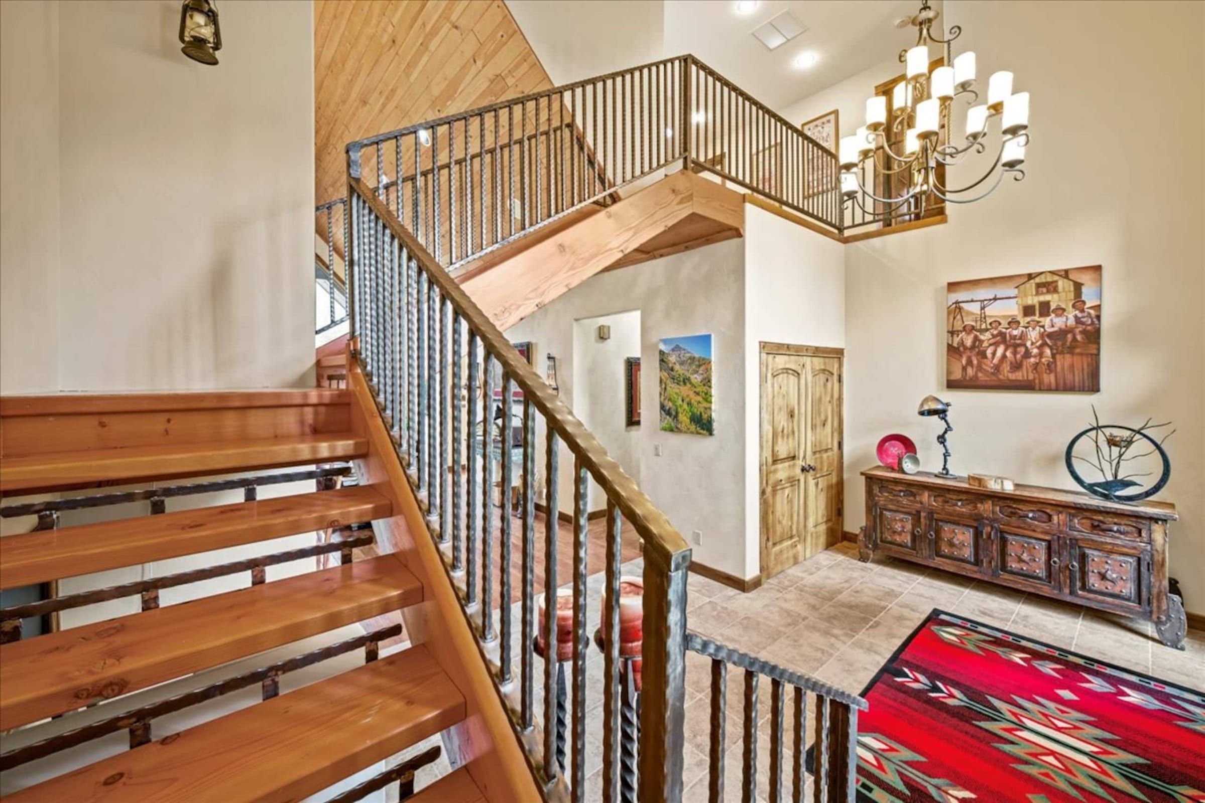 The stair landing with a chandelier