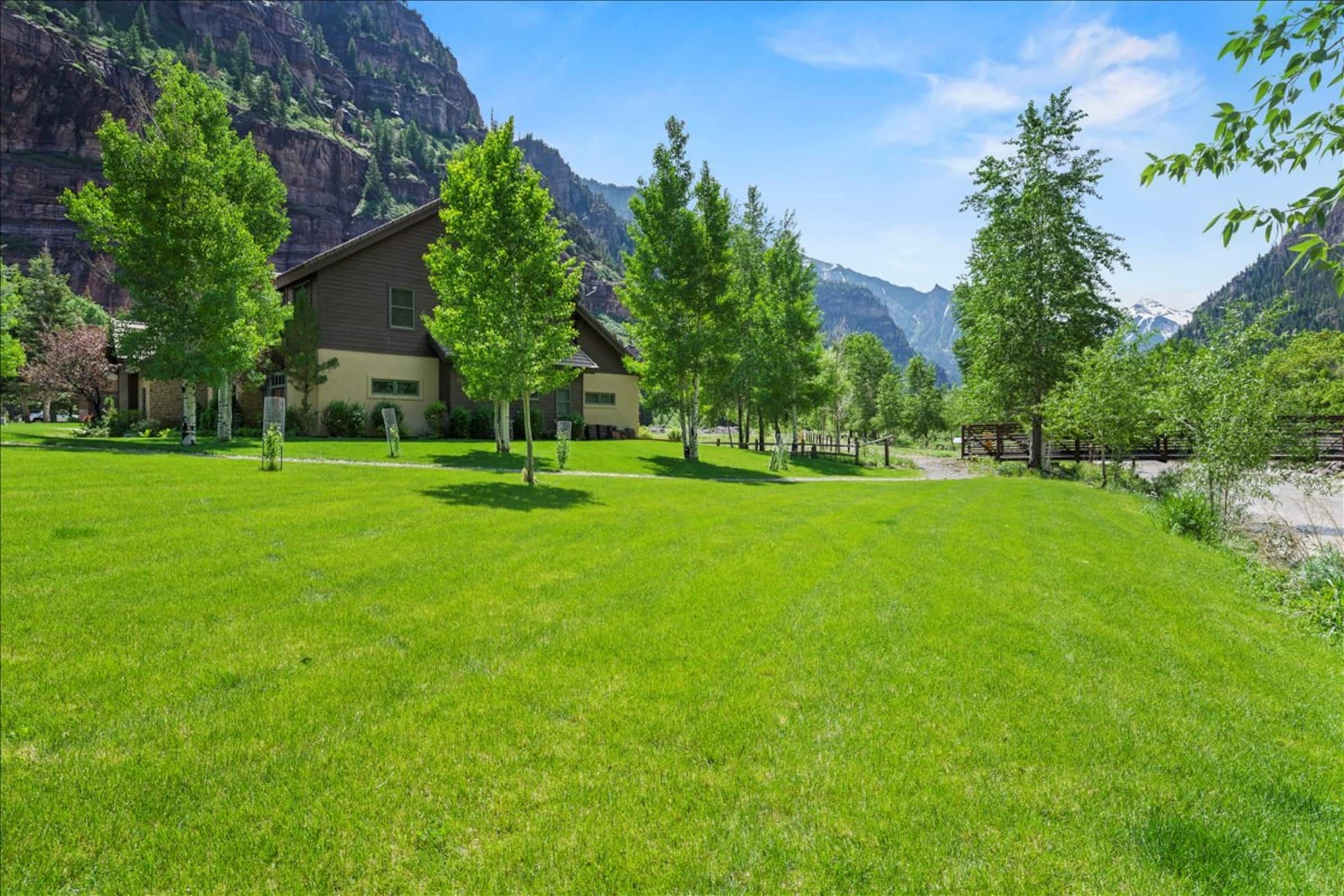 The back lawn and aspens below the canyon walls