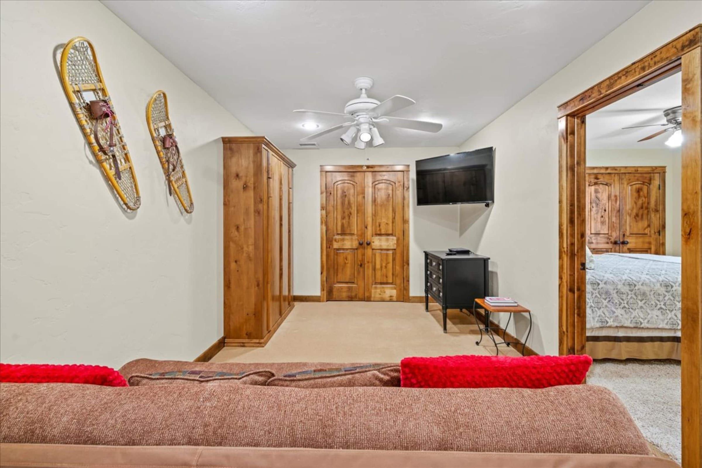 The loft, looking toward the bedroom doors and TV