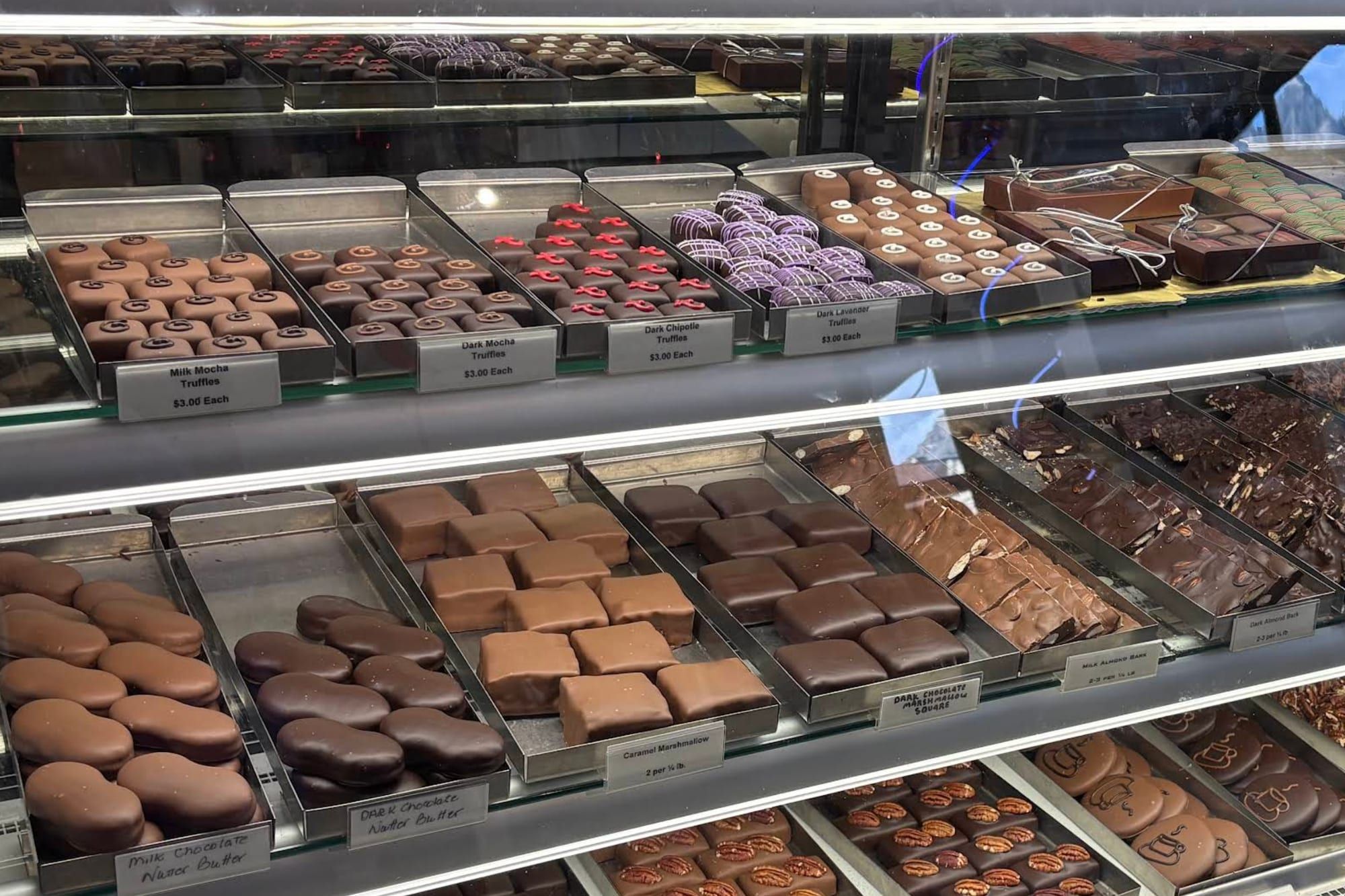 Trays of truffles and chocolates in Mouse's glass case